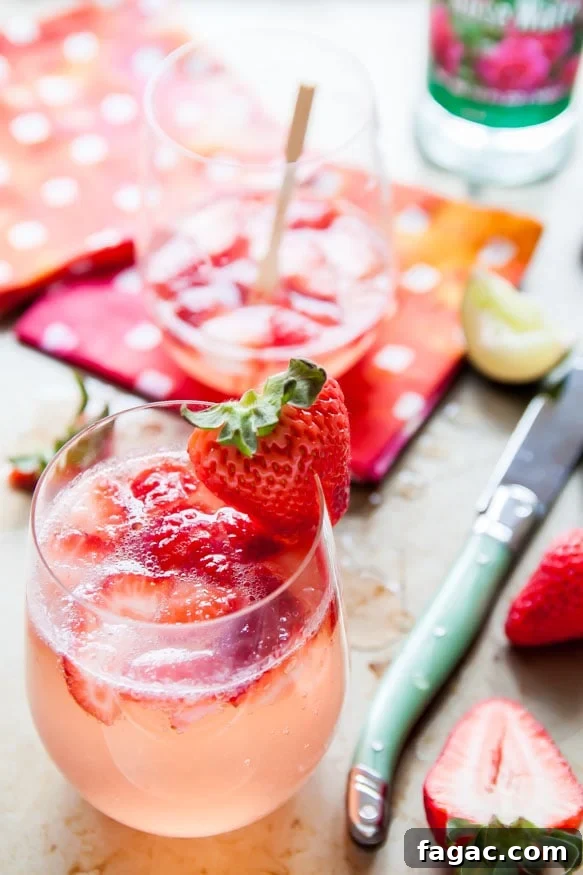 Strawberry and Rose Gin Fizz Cocktail Recipe 2 Strawberry-Rose-Gin-Fizz | dessertfortwo.com