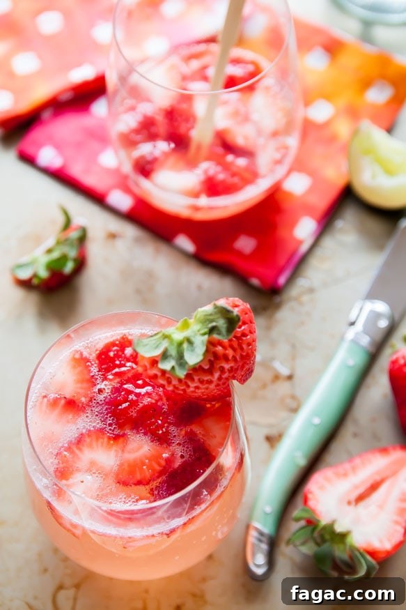 Strawberry and Rose Gin Fizz Cocktail Recipe 3 Strawberry-Rose-Gin-Fizz | dessertfortwo.com