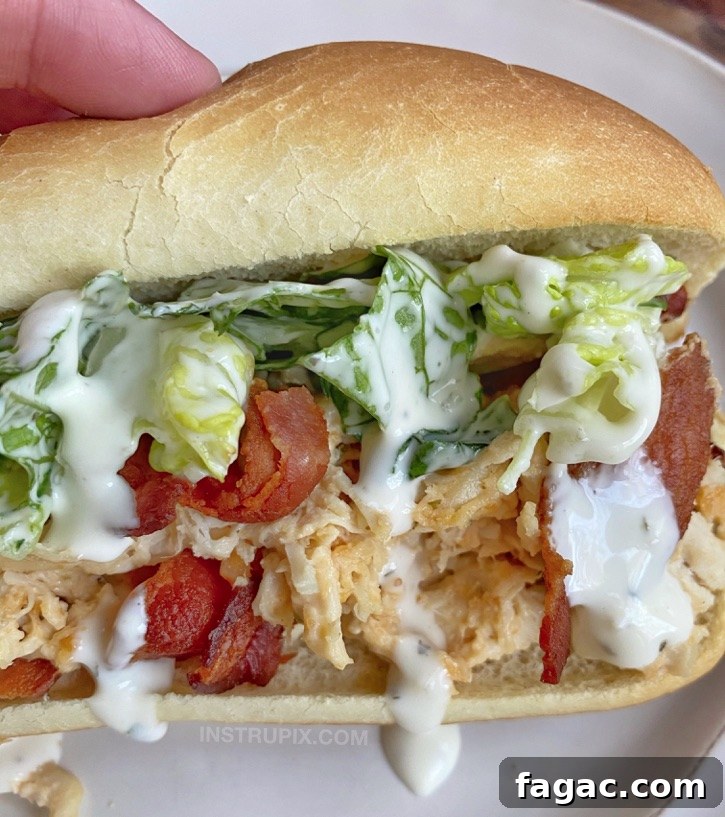 Slow Cooker Crack Chicken Sandwiches with Bacon and Cheese 2 Easy Crockpot Crack Chicken Sandwiches (the best slow cooker shredded chicken made with cream cheese, cheddar and ranch seasoning!)